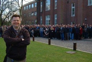 A large group of people standing in front of a building.