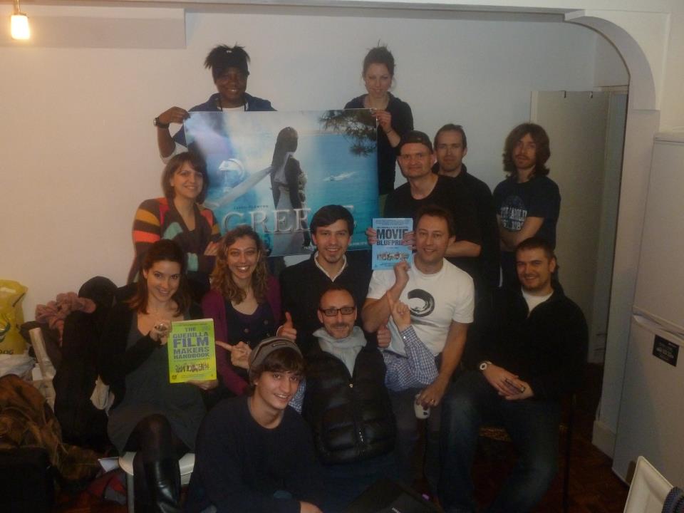 A group of people posing for a picture in a room.