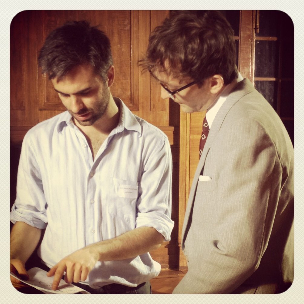 A man is looking at a piece of paper.