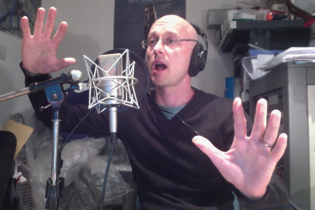 A man is singing into a microphone.